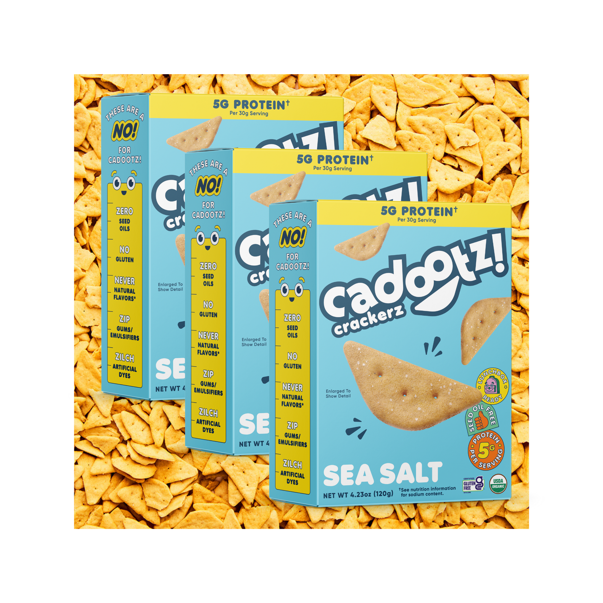 Three boxes of cadootz sea salt crackers on a bed of crackers